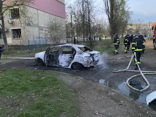 Rescue workers work on a site after Russian rocket strike on residential neighbourhood killing civilians including children, in Kryvyi Rih, Ukraine, April 4, 2025. (Na Chasi media via AP)
