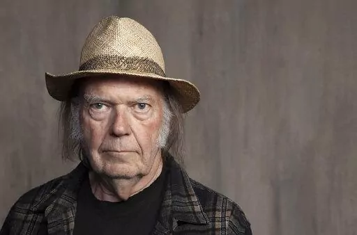Neil Young poses for a portrait at Lost Planet Editorial in Santa Monica, Calif. on Sept. 9, 2019.  Young isn't satisfied with urging his fellow musicians to join him in taking their music off the streaming service Spotify. Now he wants company employees to quit their jobs before it “eats up your soul." In a message on his website Monday, Feb. 7, 2022, Young said company CEO Daniel Ek is a bigger problem than popular podcaster Joe Rogan.  (Photo by Rebecca Cabage/Invision/AP, File)